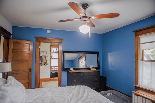 210 6th St, Morris, MN 56267 - bedroom featuring radiator heating unit, baseboards, a ceiling fan, and ensuite bathroom