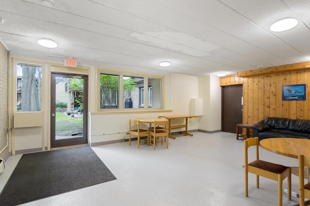 4029 14th Ave S Unit 14G, Minneapolis, MN 55407 - dining space with wood walls and baseboards