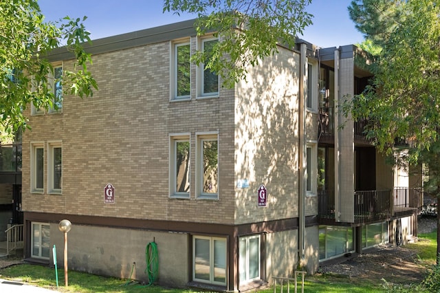 4029 14th Ave S Unit 14G, Minneapolis, MN 55407 - rear view of property featuring brick siding