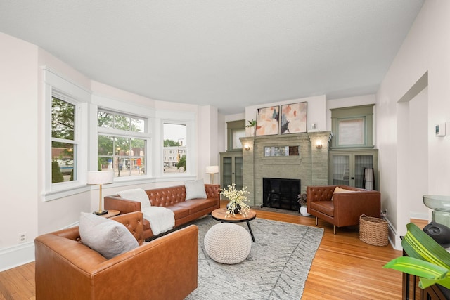 1836 Marshall Ave, Saint Paul, MN 55104 - living room with wood finished floors and a fireplace