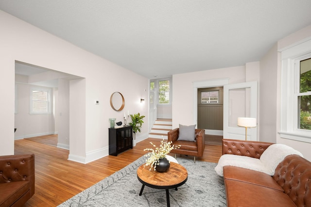 1836 Marshall Ave, Saint Paul, MN 55104 - living room with light wood-type flooring and stairs