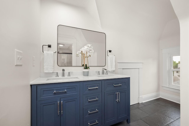 1836 Marshall Ave, Saint Paul, MN 55104 - bathroom with double vanity and vaulted ceiling