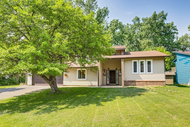 2723 Innsbruck Dr, New Brighton, MN 55112 - view of front of house with a front lawn, driveway, an attached garage, and roof with shingles