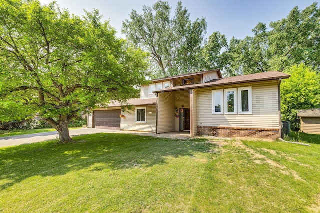 2723 Innsbruck Dr, New Brighton, MN 55112 - view of front of property featuring an attached garage, a front lawn, and concrete driveway