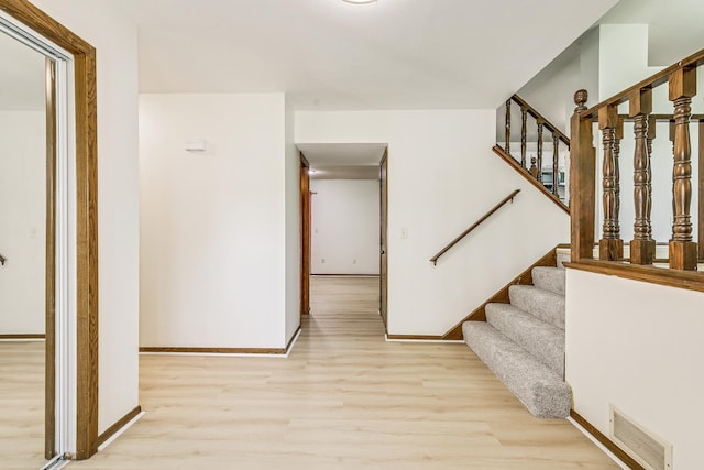 2723 Innsbruck Dr, New Brighton, MN 55112 - foyer with light wood-type flooring, baseboards, and stairway