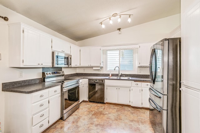2723 Innsbruck Dr, New Brighton, MN 55112 - kitchen with appliances with stainless steel finishes, a sink, dark countertops, lofted ceiling, and white cabinetry