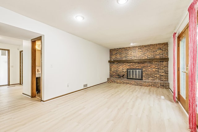 2723 Innsbruck Dr, New Brighton, MN 55112 - unfurnished living room with wood finished floors, a fireplace, baseboards, healthy amount of natural light, and recessed lighting
