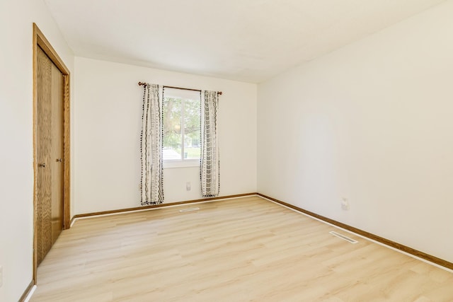 2723 Innsbruck Dr, New Brighton, MN 55112 - spare room with light wood-style flooring and baseboards
