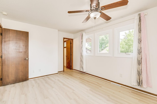 2723 Innsbruck Dr, New Brighton, MN 55112 - unfurnished bedroom with wood finished floors, baseboards, and ceiling fan