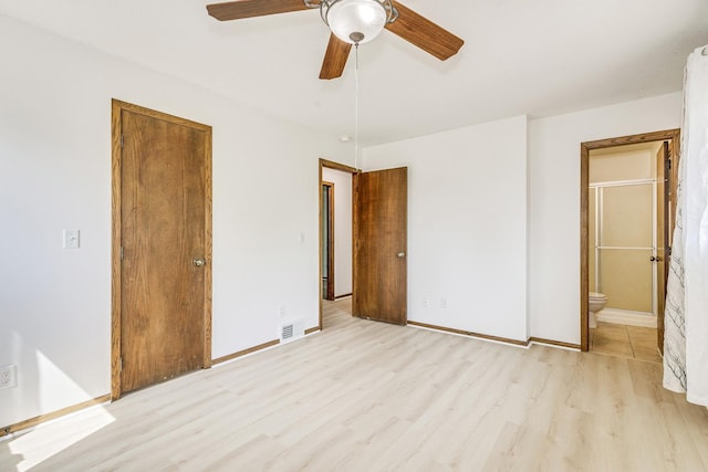 2723 Innsbruck Dr, New Brighton, MN 55112 - unfurnished bedroom featuring light wood-style flooring, connected bathroom, baseboards, a closet, and ceiling fan