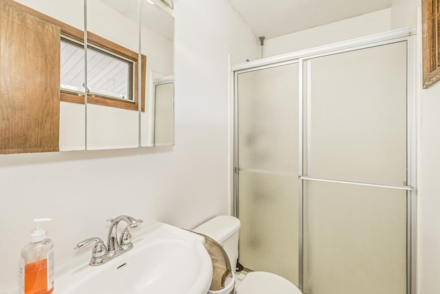 2723 Innsbruck Dr, New Brighton, MN 55112 - bathroom featuring a sink, toilet, and an enclosed shower