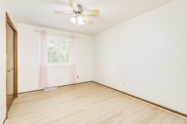 2723 Innsbruck Dr, New Brighton, MN 55112 - unfurnished bedroom featuring light wood-type flooring, baseboards, a ceiling fan, and a closet