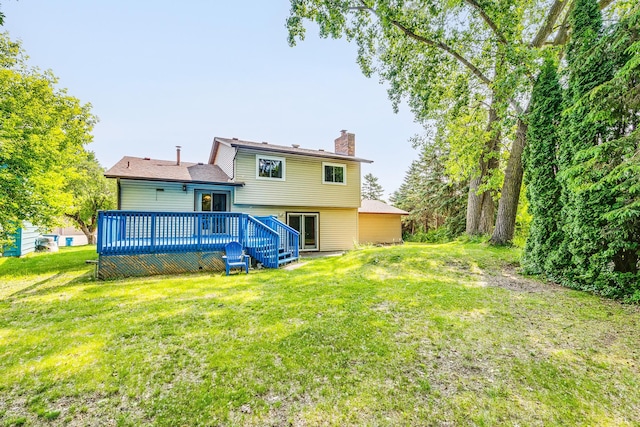 2723 Innsbruck Dr, New Brighton, MN 55112 - back of property with a chimney, a yard, and a deck