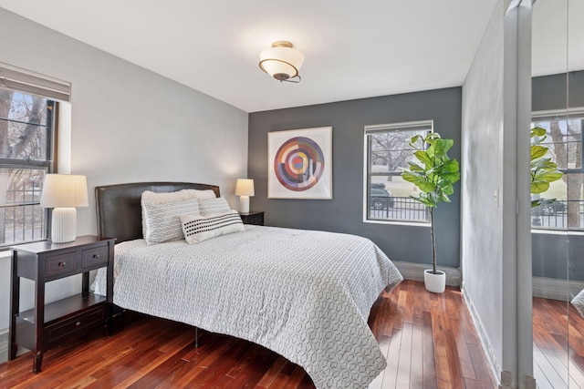 2201 3rd Ave S Unit 102, Minneapolis, MN 55404 - bedroom featuring hardwood / wood-style flooring and baseboards