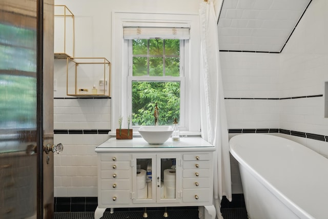 4848 Ewing Ave S, Minneapolis, MN 55410 - full bath with tile walls, a freestanding bath, tile patterned flooring, and vanity