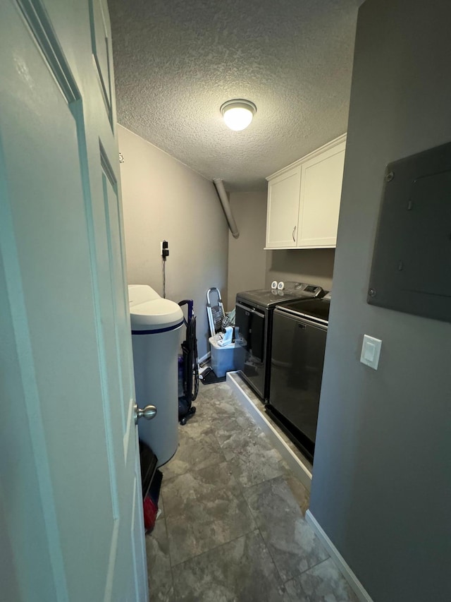 4198 Hilltop Ln, Eagan, MN 55123 - washroom featuring cabinet space, electric panel, washer and clothes dryer, and a textured ceiling