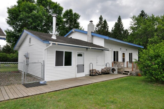 24892 277th Ave, Akeley Twp, MN 56467 - back of house featuring a deck and a chimney