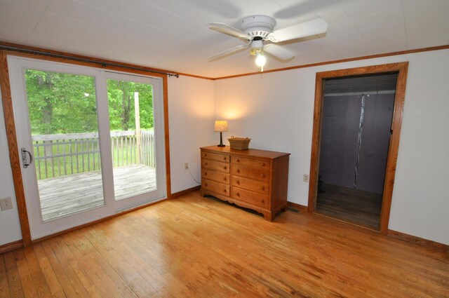 24892 277th Ave, Akeley Twp, MN 56467 - bedroom with access to exterior, light wood-style floors, ornamental molding, and a ceiling fan