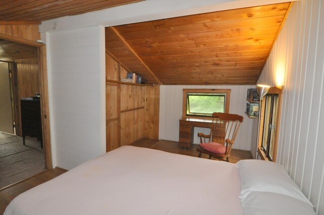 24892 277th Ave, Akeley Twp, MN 56467 - bedroom featuring wood ceiling, wooden walls, vaulted ceiling, and wood finished floors