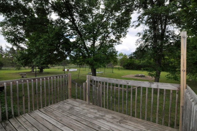 24892 277th Ave, Akeley Twp, MN 56467 - wooden deck with a lawn and a fire pit