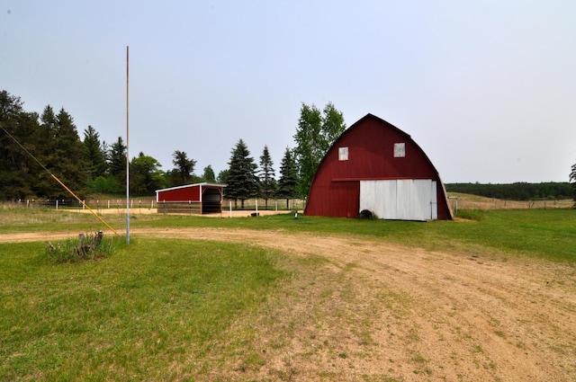 24892 277th Ave, Akeley Twp, MN 56467 - view of green lawn with a barn and an outdoor structure