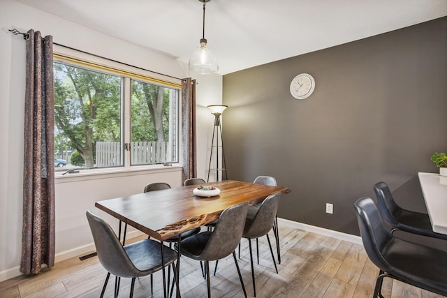 9106 Neill Lake Rd, Eden Prairie, MN 55347 - dining space featuring light wood-style floors and baseboards