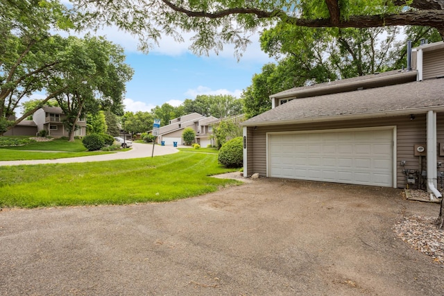 9106 Neill Lake Rd, Eden Prairie, MN 55347 - garage featuring driveway and a residential view