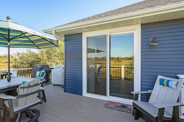 7720 242nd St, Wyoming, MN 55025 - wooden deck with area for grilling and outdoor dining area