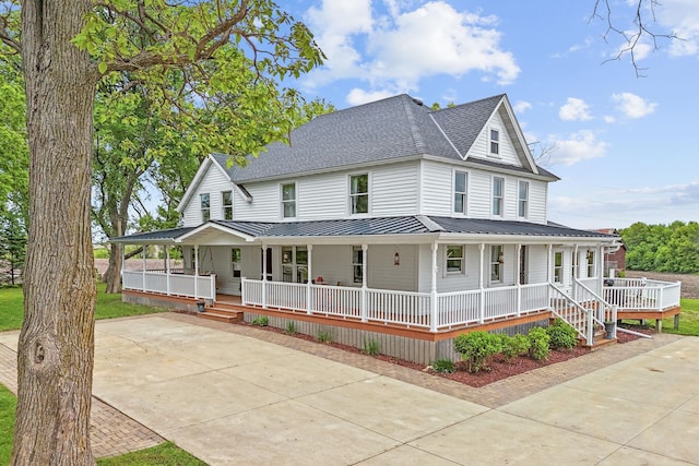 27151 Aberdeen Ave, New Prague, MN 56071 - farmhouse inspired home featuring covered porch, a standing seam roof, metal roof, a shingled roof, and driveway