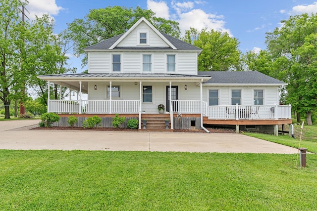 27151 Aberdeen Ave, New Prague, MN 56071 - farmhouse inspired home with a standing seam roof, a front yard, a porch, metal roof, and a shingled roof