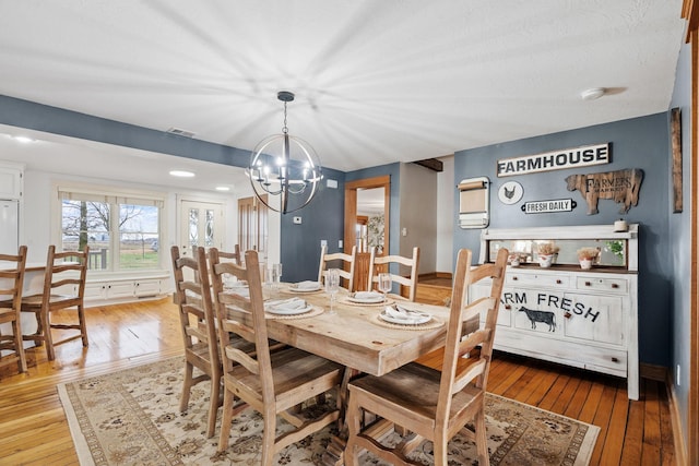 27151 Aberdeen Ave, New Prague, MN 56071 - dining area with hardwood / wood-style floors and a chandelier