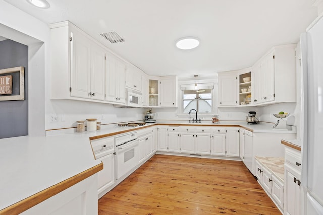 27151 Aberdeen Ave, New Prague, MN 56071 - kitchen featuring white appliances, white cabinets, and light countertops