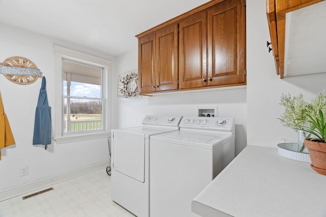 27151 Aberdeen Ave, New Prague, MN 56071 - laundry room with cabinet space, separate washer and dryer, baseboards, and light floors
