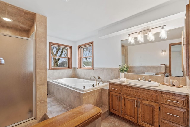 27151 Aberdeen Ave, New Prague, MN 56071 - full bath featuring vanity, tile patterned floors, a whirlpool tub, and a shower stall