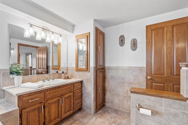 27151 Aberdeen Ave, New Prague, MN 56071 - bathroom featuring vanity, tile walls, wainscoting, and tile patterned flooring