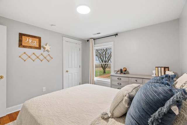 27151 Aberdeen Ave, New Prague, MN 56071 - bedroom featuring wood finished floors and baseboards