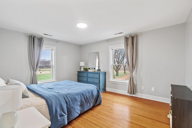 27151 Aberdeen Ave, New Prague, MN 56071 - bedroom featuring light wood-type flooring, baseboards, and multiple windows