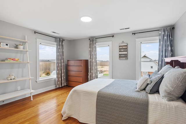 27151 Aberdeen Ave, New Prague, MN 56071 - bedroom with hardwood / wood-style flooring and baseboards