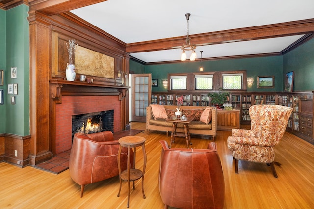 2525 2nd St, Duluth, MN 55812 - living area with wood finished floors, crown molding, and a brick fireplace