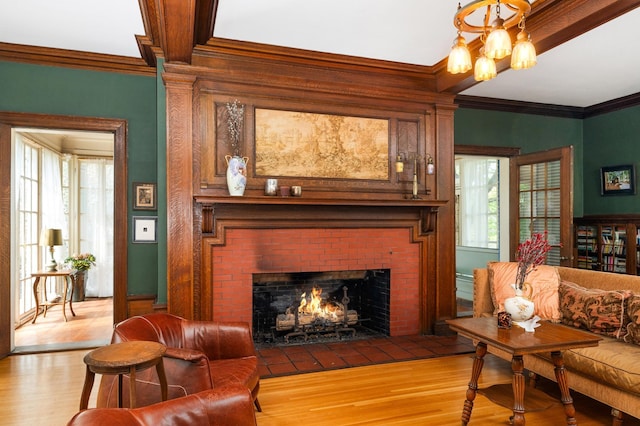 2525 2nd St, Duluth, MN 55812 - living room with wood finished floors, plenty of natural light, a brick fireplace, and crown molding