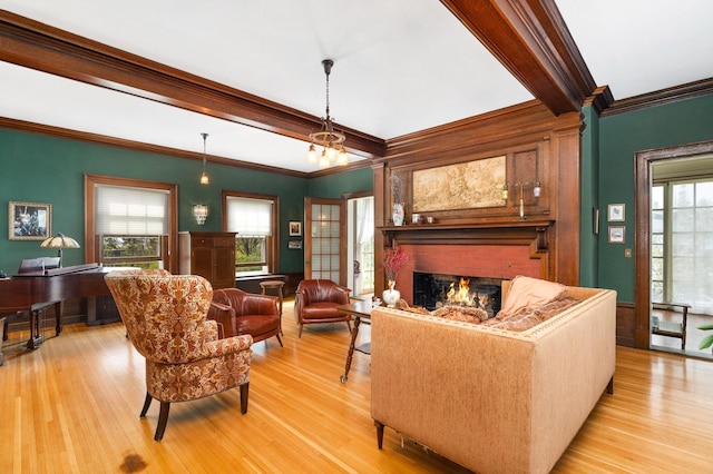 2525 2nd St, Duluth, MN 55812 - living area with ornamental molding, light wood-type flooring, a brick fireplace, and beamed ceiling