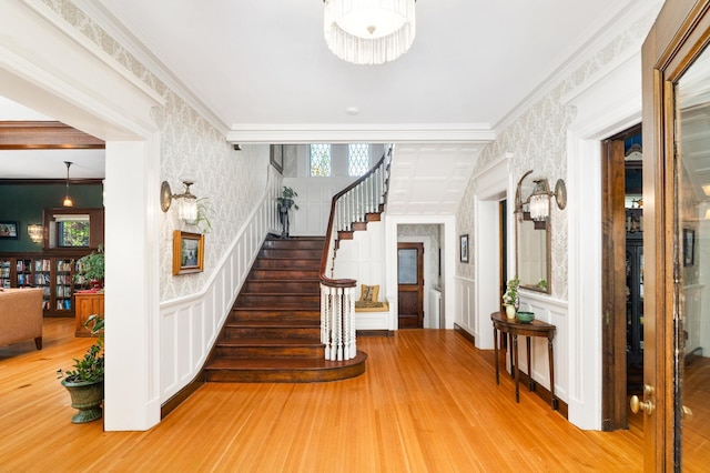 2525 2nd St, Duluth, MN 55812 - foyer with a decorative wall, stairway, wood finished floors, healthy amount of natural light, and crown molding