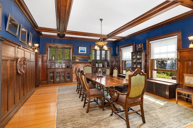2525 2nd St, Duluth, MN 55812 - dining room featuring a chandelier, crown molding, light wood-type flooring, beam ceiling, and a wainscoted wall