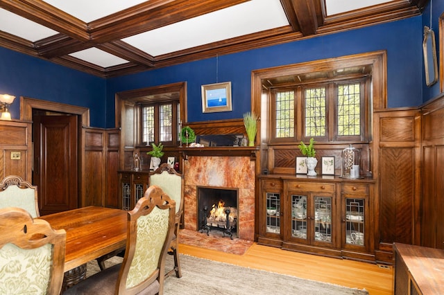 2525 2nd St, Duluth, MN 55812 - dining area featuring coffered ceiling, a premium fireplace, beam ceiling, wood finished floors, and crown molding