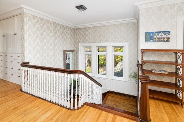 2525 2nd St, Duluth, MN 55812 - stairway featuring wood finished floors, wallpapered walls, and ornamental molding