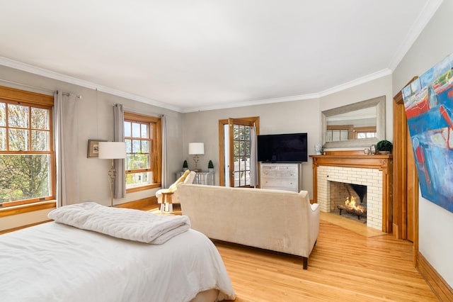 2525 2nd St, Duluth, MN 55812 - bedroom featuring ornamental molding, light wood-style floors, a fireplace, and baseboards