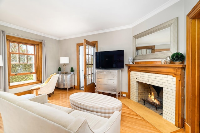 2525 2nd St, Duluth, MN 55812 - living area featuring a fireplace, wood finished floors, plenty of natural light, ornamental molding, and baseboards