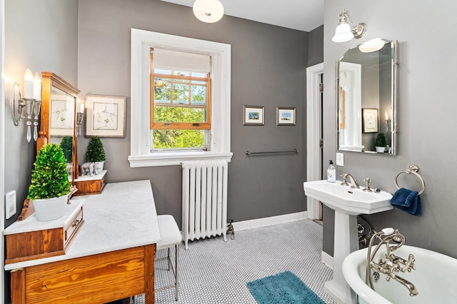2525 2nd St, Duluth, MN 55812 - full bathroom with radiator heating unit, a soaking tub, and baseboards