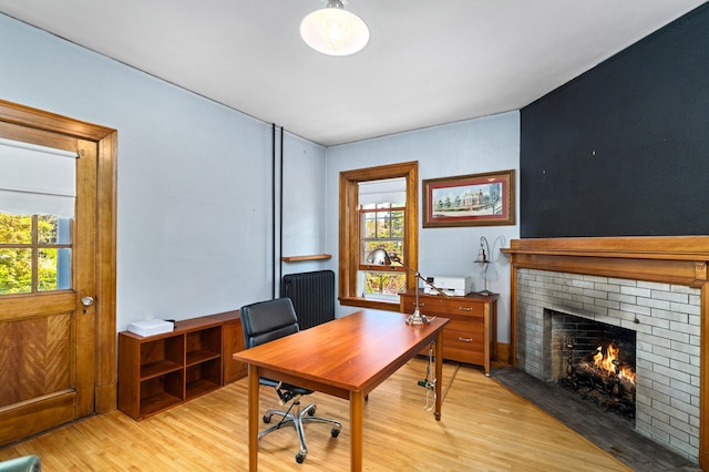 2525 2nd St, Duluth, MN 55812 - office featuring plenty of natural light, a brick fireplace, and light wood-type flooring