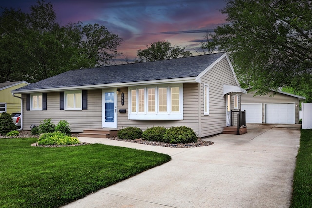 1821 4th Ave NE, Austin, MN 55912 - single story home with an outdoor structure, a garage, a front lawn, and a shingled roof